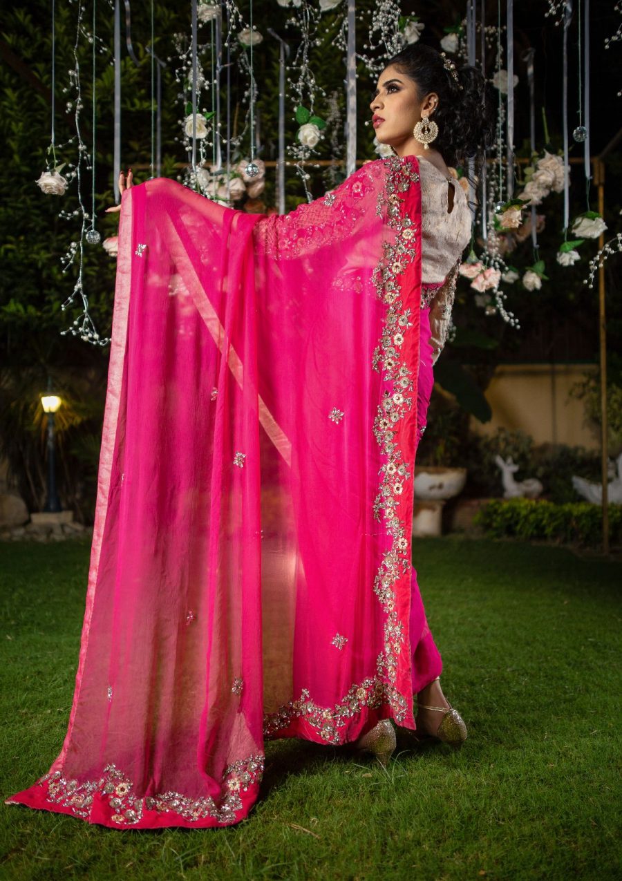Beautifully embellished chiffon saree in contrasting tones with stones work on it, blouse of saree is on lama fabric. 
