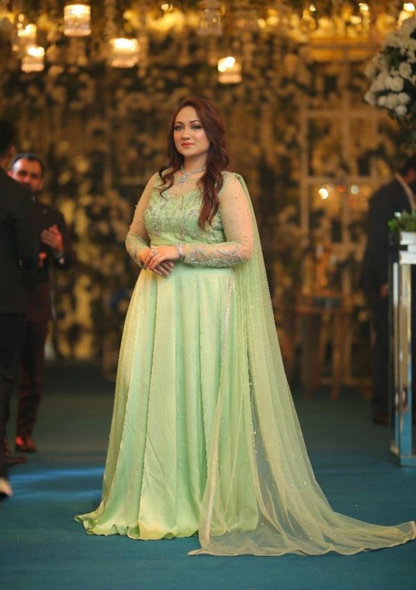 Stylish cutline pure silk gown with full flared having modern pattern of work on its bodice having handwork of silver and self shaded cutdana with silver bethki spray on it. Also net dopata attached from shoulder having spray of bethki work on it.