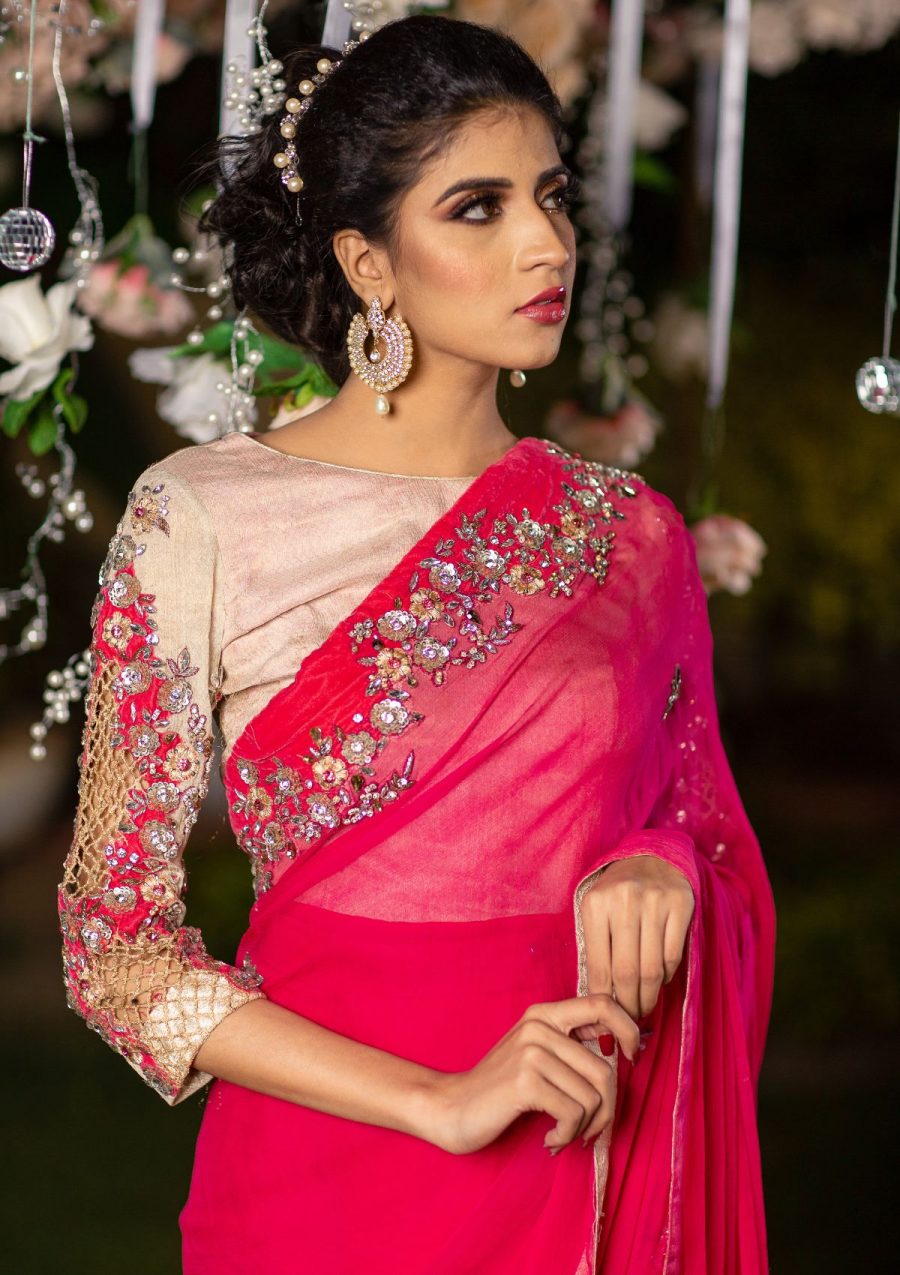 Beautifully embellished chiffon saree in contrasting tones with stones work on it, blouse of saree is on lama fabric. 