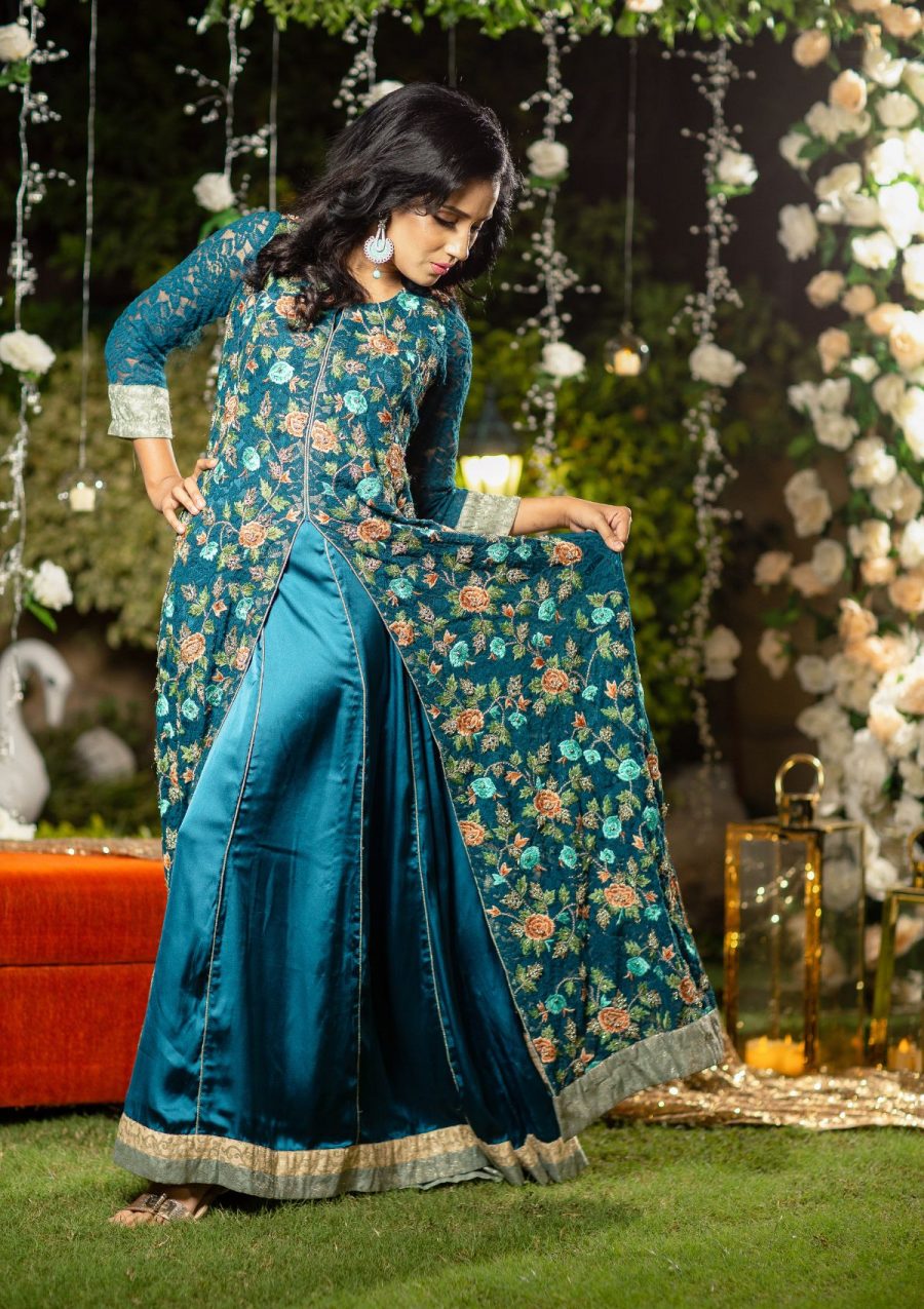 Heavily embroidered front open net jacket with fully handwork of tilla, threads, naqshi dapka and stoneswork on it. Lower panelled gown is of plain silk fabric with same color as well.