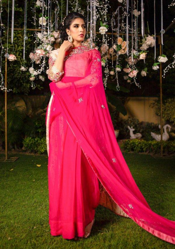 Beautifully embellished chiffon saree in contrasting tones with stones work on it, blouse of saree is on lama fabric.